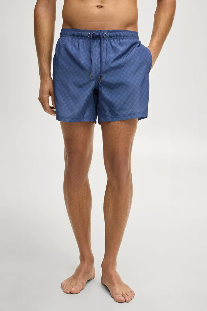 Leads to product detail page "Swim shorts in cornflower blue"