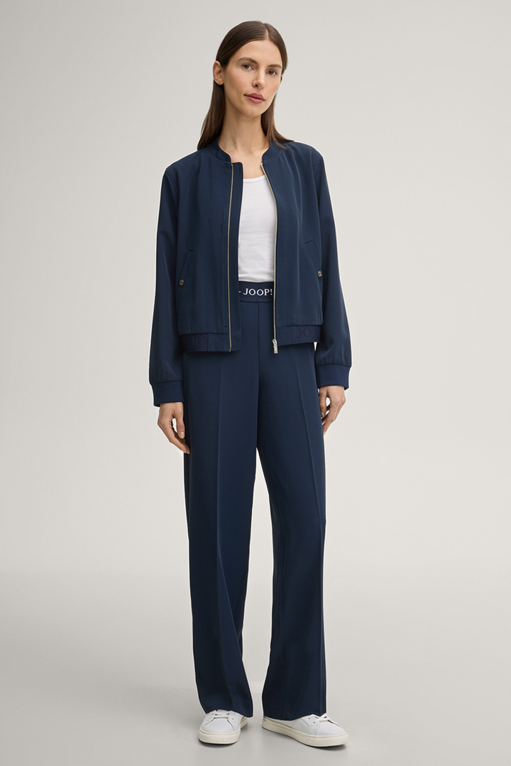 Leads to product detail page "Piara Fabric Slacks in Navy"