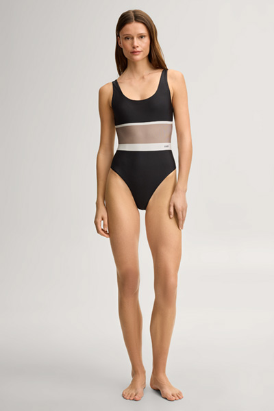 Leads to product detail page "Swimsuit in black/brown"