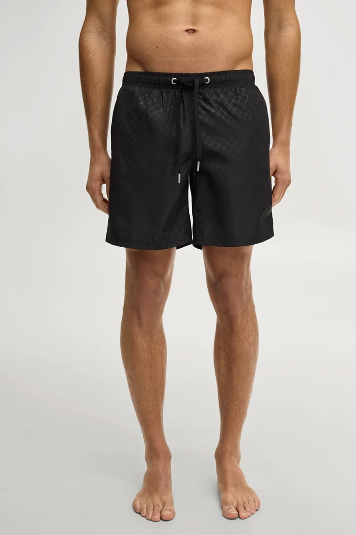 Leads to product detail page "Cornflower Board shorts in black/grey patterned"