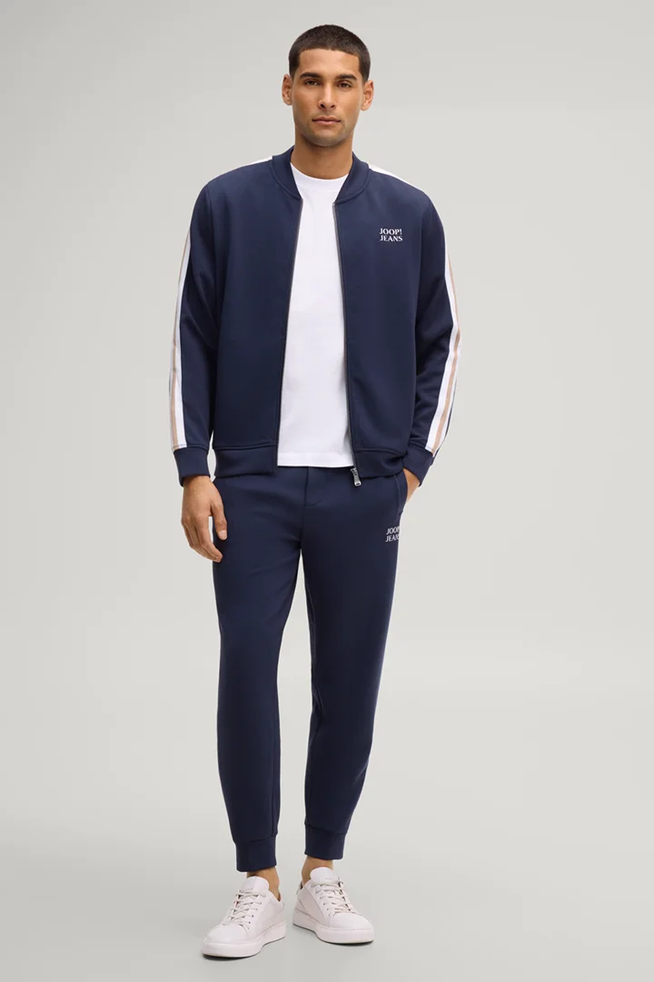 Leads to product detail page "Aka sweatpants in navy"