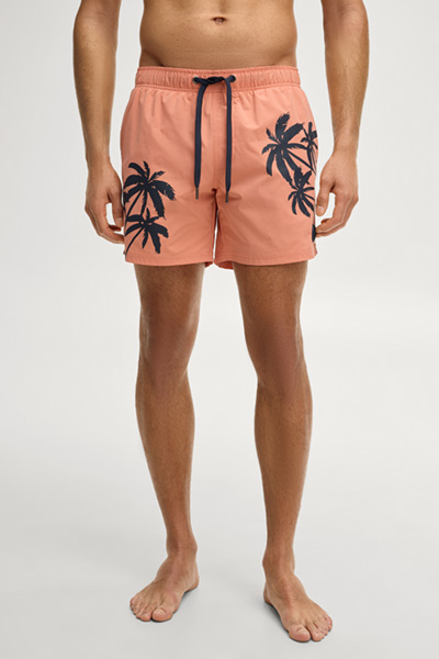 Swim shorts in coral palm print