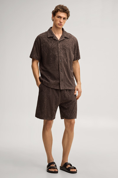 Leads to product detail page "Wailoa patterned sweat shorts in dark brown"