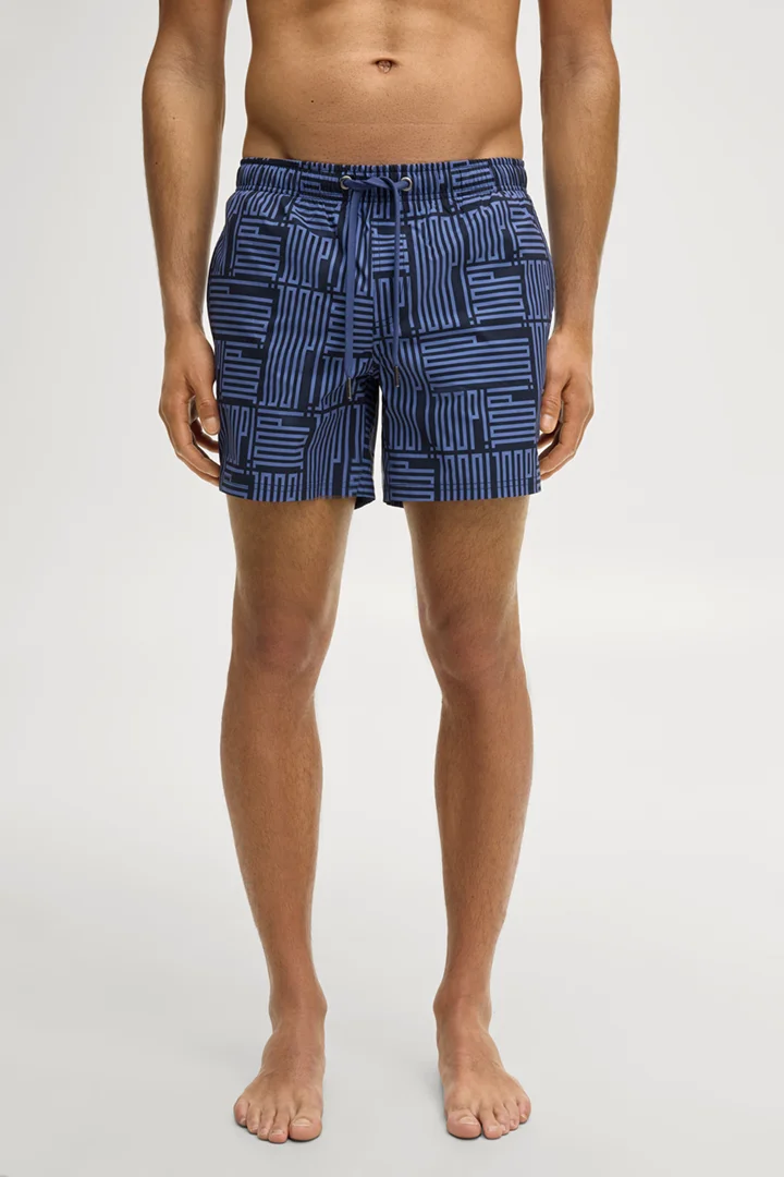 Leads to product detail page "Dark blue patterned swim shorts"