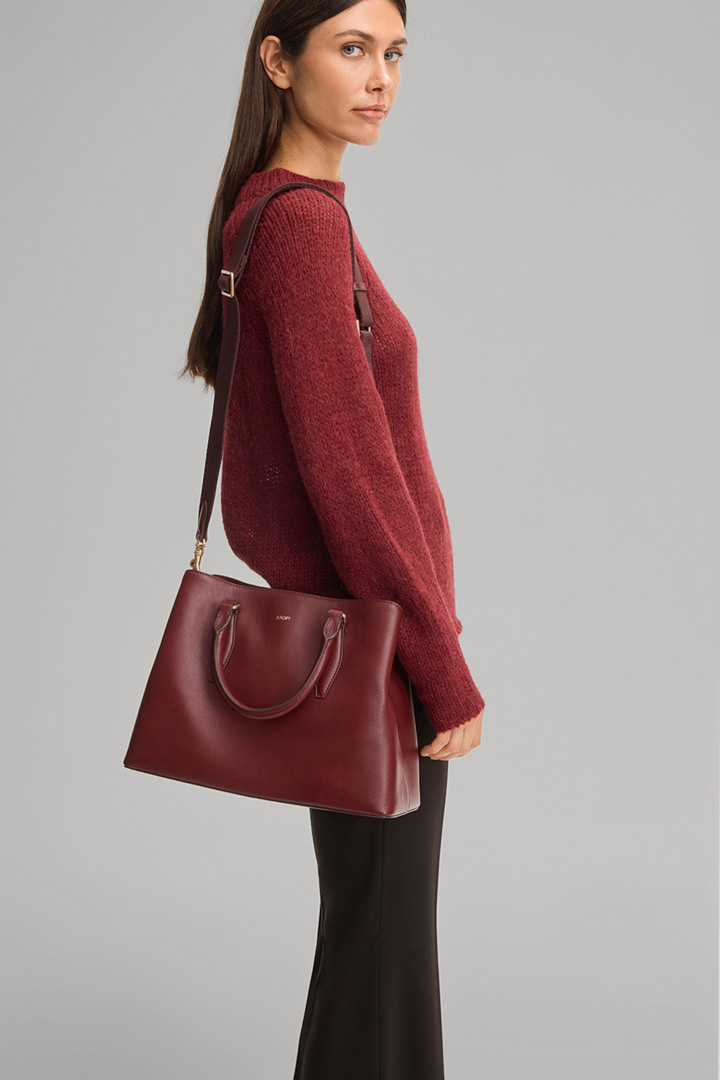 Leads to product detail page "Sofisticato Emery Handbag in Red"