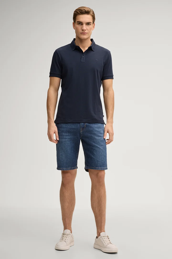 Leads to product detail page "Primo polo shirt in dark blue"