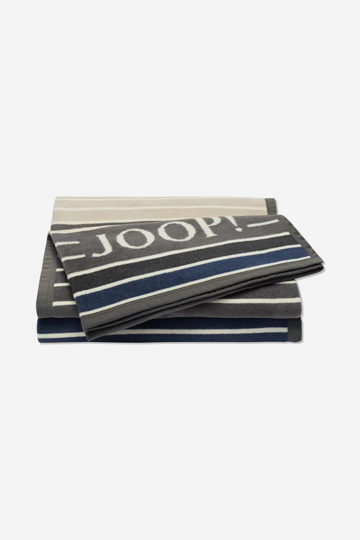 Führt zu Produktdetailseite „Wohndecke JOOP! OUTDOOR LIFESTYLE in Curry/Stein, 125 x 170 cm"