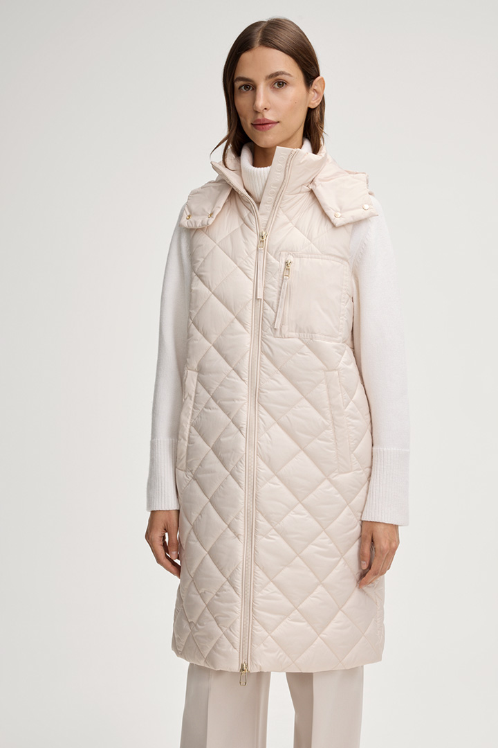 Leads to product detail page "Quilted Waistcoat in Cream"