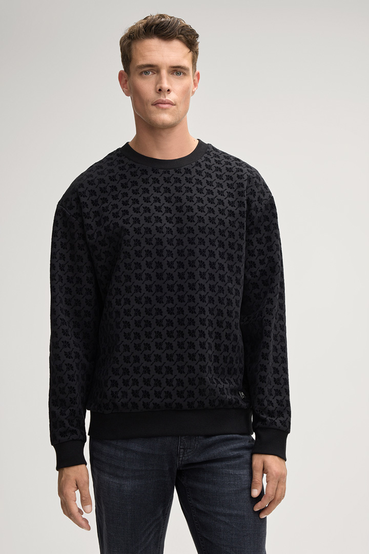 Leads to product detail page "Tamino Cornflower Sweatshirt in Black"