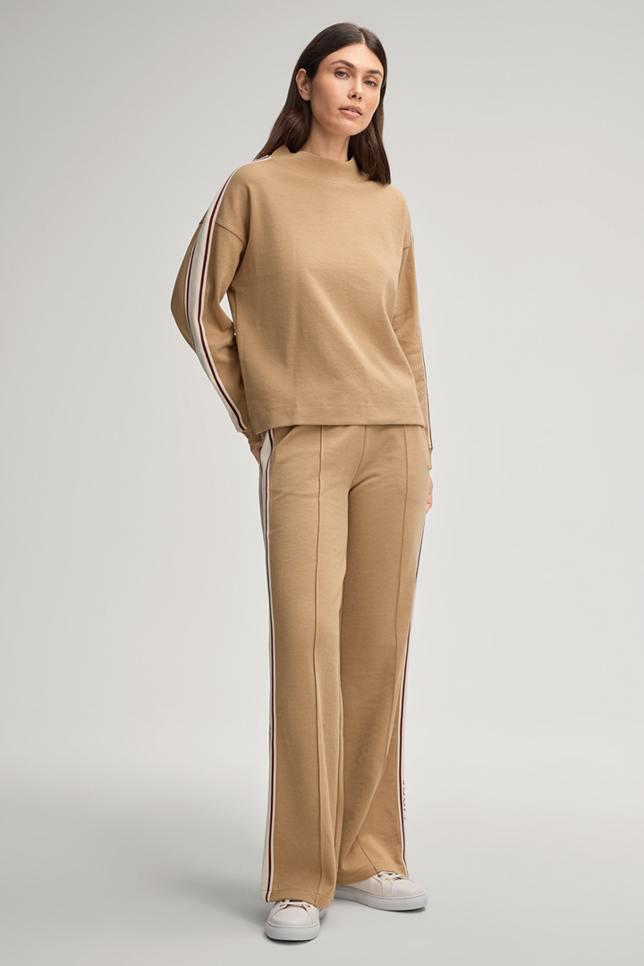 Leads to look detail page “Shop the look: Beige sweatsuit”