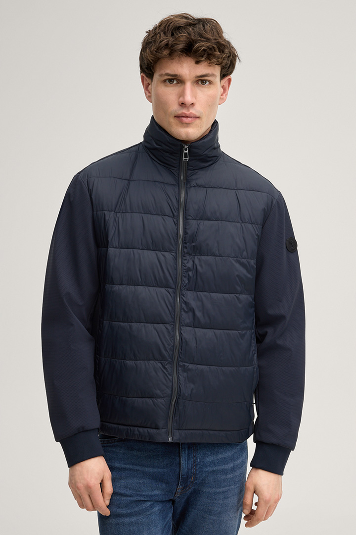 Leads to product detail page "Miguel Quilted Jacket in Navy"