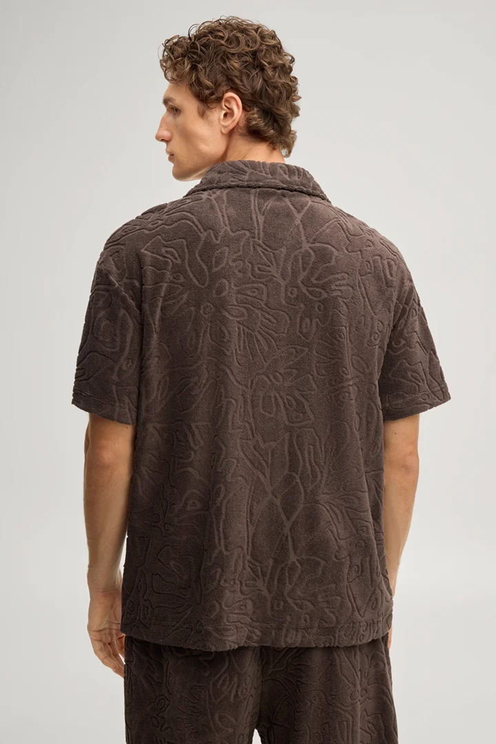 Leads to product detail page "Moala sweatshirt in dark brown with a pattern"