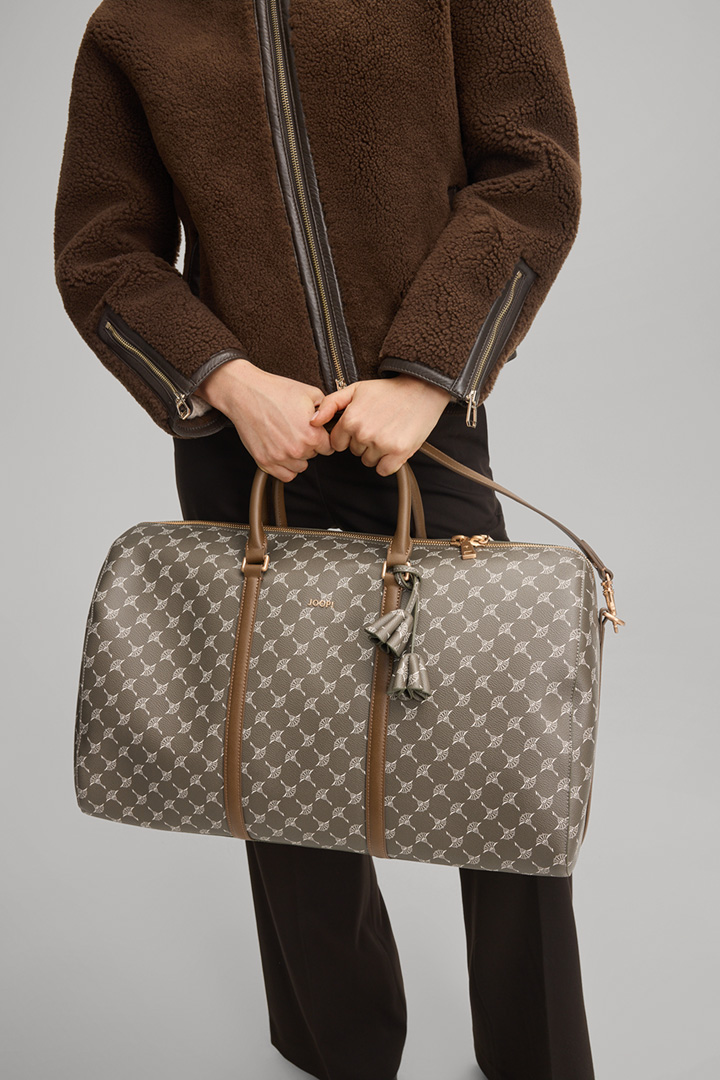 Leads to product detail page "Cortina Aurora Cornflower Weekender in Khaki"