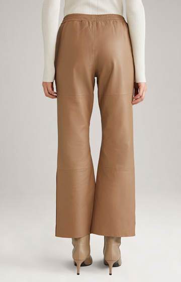 Leather trousers in beige